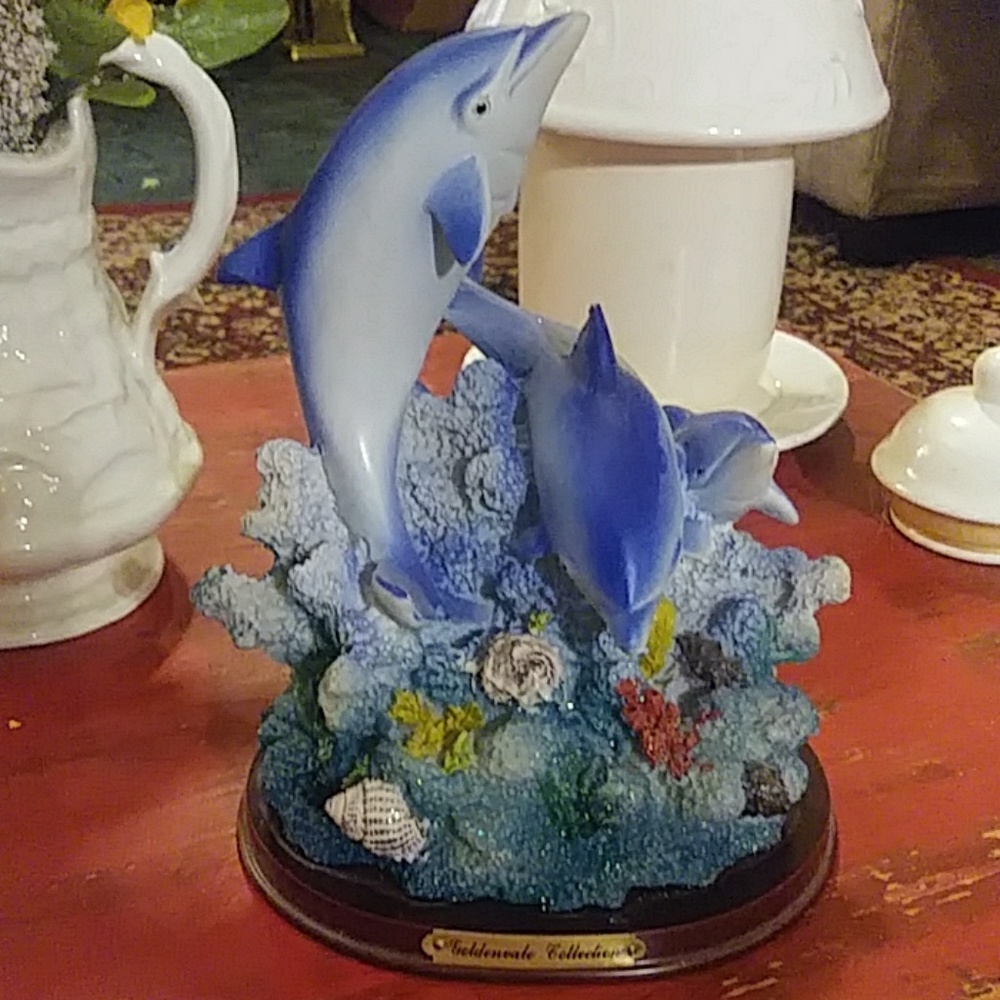 Playing dolphins figurine